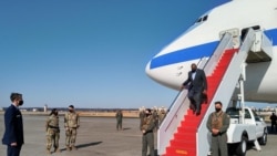 US Defense Secretary Lloyd Austin (2nd R) gets off a plane upon his arrival at the US Yokota Air Base in Tokyo on March 15, 2021. (Photo by Sylvie LANTEAUME / AFP)
