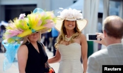 The Kentucky Derby is a BIG deal in Kentucky. People usually dress up to wathch the famous horse race. Women wear big, beautiful hats. May 3, 2014 (Jamie Rhodes-USA TODAY Sports)
