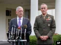 FILE - Defense Secretary Jim Mattis, left, accompanied by Joint Chiefs Chairman Gen. Joseph Dunford, right, speaks to members of the media outside the West Wing of the White House in Washington, Sunday, Sept. 3, 2017, regarding the escalating crisis in North Kor