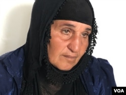 Iraqi village woman who has survived 13 years of war and 2 years under IS, now in a refugee camp outside Makhmour, Iraq, April 11, 2016. (S. Behn/VOA)