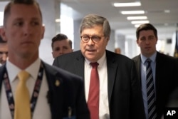 FILE - Since confirmed Attorney General nominee Bill Barr arrives for a meeting on Capitol Hill in Washington, Jan. 26, 2019.