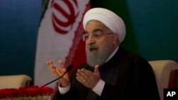 FILE - Iranian President Hassan Rouhani speaks during a meeting with Muslims leaders and scholars in Hyderabad, India, Feb. 15, 2018.