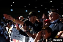 Supporters cheer for Republican presidential nominee Donald Trump during a campaign rally in Minneapolis, Minnesota, Nov. 6, 2016.