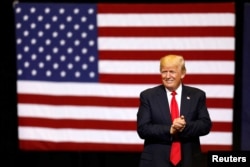 FILE - U.S. President Donald Trump takes the stage for a rally at the U.S. Cellular Center in Cedar Rapids, Iowa, U.S.