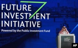 FILE - In this photo released by Saudi Press Agency, SPA, Saudi Minister of Commerce and Investment Majid al-Qasabi talks to the audience at the opening of Future Investment Initiative conference in Riyadh, Saudi Arabia, Oct. 24, 2017.