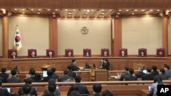 Judges of the Constitutional Court sit during the final hearing on whether to confirm the impeachment of President Park Geun-hye at the Court in Seoul, South Korea, Feb. 27, 2017