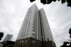 A view of Burnham residential tower on the Chalcots Estate showing the bottom section of the building after cladding was removed, in the borough of Camden, north London, June 22, 2017. The cladding was deemed to be a safety concern.