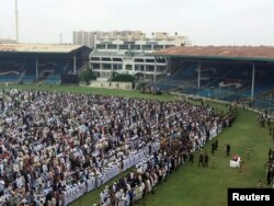 FILE - People attend the funeral for philanthropist Abdul Sattar Edhi at the National Stadium in Karachi, Pakistan, July 9, 2016.