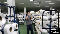 An employee works inside a textile mill in Yiwu, Zhejiang province.