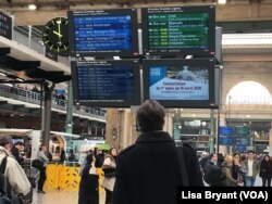 Passengers await trains to northern France and the Netherlands at the Gare du Nord train station in Paris.