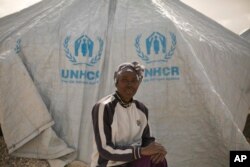 In this March 31, 2019, photo, Gailon Lawson, from Trinidad and Tobago, poses for a portrait at Al-Hol camp in Hassakeh province, Syria. (AP Photo/Maya Alleruzzo)