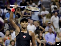 Naomi Osaka, of Japan, celebrates after defeating Madison Keys during the semifinals of the U.S. Open tennis tournament, Thursday, Sept. 6, 2018, in New York. (AP Photo/Seth Wenig)