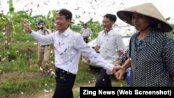 FILE - Fish farmer Doan Van Vuon received hero's welcome after being released early.