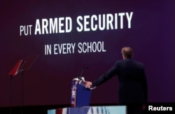 NRA Executive Vice President and CEO Wayne LaPierre watches an NRA promotional video while speaking at the Conservative Political Action Conference (CPAC) at National Harbor, Maryland, Feb. 22, 2018.