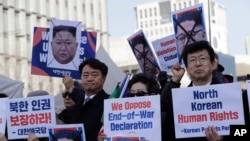 FILE - South Korean protesters and North Korean defectors attend a rally urging the United States to discuss North Korean human rights issue in an upcoming meeting between Trump and Kim.