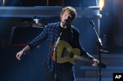 FILE - Ed Sheeran performs at "Stevie Wonder: Songs in the Key of Life - An All-Star Grammy Salute," at the Nokia Theatre L.A. Live on Feb. 10, 2015, in Los Angeles.