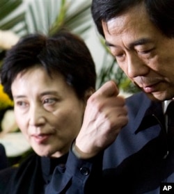 FILE - Gu Kailai, left, and husband Bo Xilai, shown in 2007, now are in prison.