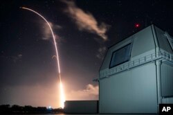 FILE - This Monday, Dec. 10, 2018, file photo provided by the U.S. Missile Defense Agency (MDA) shows the launch of the U.S. military's land-based Aegis missile defense testing system. (Mark Wright/Missile Defense Agency via AP, File)