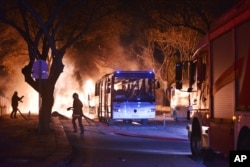 Firefighters work at a scene of fire from an explosion in Ankara, Feb. 17, 2016.
