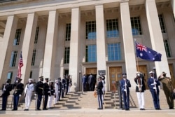 Defense Secretary Lloyd Austin stands with Australian Minister of Defense Peter Dutton during a ceremony at the Pentagon in Washington, Wednesday, Sept. 15, 2021.