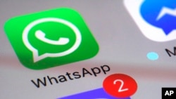 WhatsApp appears on a smartphone, March 10, 2017, in New York.