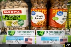 Imported nuts from the United States are displayed at a supermarket in Beijing, March 23, 2018.