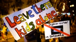 Demonstrators march to oppose the vaccine pass proposal and ongoing government restrictions in Barcelona, Spain, Dec. 18, 2021.