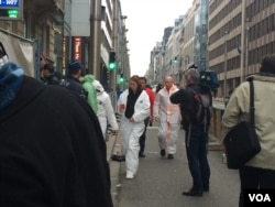 FILE - Crews arrive in Brussels to assess damage to the Maelbeek metro station, one of two targets in an attack that killed 32 people and injured 300, March 24, 2016. (H. Murdock/VOA)