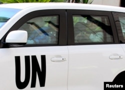 UN inspectors leave the Four Seasons Hotel in their vehicles in Damascus, Syria, Aug. 29, 2013.