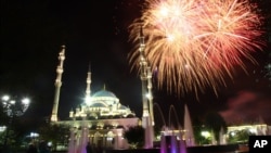 Fireworks illuminate the sky at the 'Heart of Chechnya' mosque to mark national election day in Chechnya's provincial capital Grozny, Russia, Sept. 18, 2016.