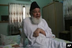 Shamim Uddin, 89, speaks to the Associated Press in Karachi, Pakistan, July 30, 2017. Uddin remembers the tortuous journey made with his young wife and child from what is now the Indian state of Uttar Pradesh.