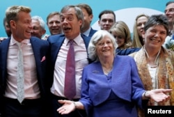 Leader of the Brexit Party Nigel Farage and newly elected Members of the European Parliament from Brexit Party attend a news conference following the results of the European Parliament elections, in London, Britain, May 27, 2019.