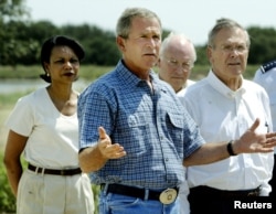 In this August 8, 2003 file photo, US President George W. Bush is flanked by (L-R) National Security Advisor Condoleezza Rice, Vice President Dick Cheney, and Secretary of Defense Donald Rumsfeld.