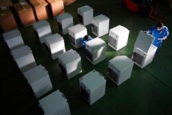 Brand-new ultralow-temperature freezers able to store COVID-19 vaccines are seen at a warehouse at Kanou Reiki, a freezer supplier, in Sagamihara, west of Tokyo.