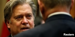 FILE - U.S. President Donald Trump's chief strategist Steve Bannon speaks with Homeland Security Secretary John Kelly at the White House in Washington Jan. 31, 2017.