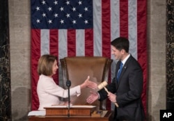 House Speaker Paul Ryan of Wisconsin reaches to shake hands with House Minority Leader Nancy Pelosi of California on Capitol Hill in Washington, D.C., Jan. 3, 2017.