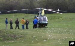 A Sonoma County Sheriff's helicopter lands on the Vintners Golf Club near the entrance to the Veterans Home of California in Yountville, California, March 9, 2018.
