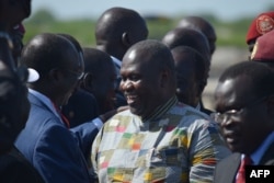 FILE - Rebel leader Riek Machar (C) meets with his supporters after landing at Juba international airport on April 26, 2016.