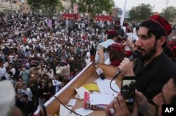 FILE - Manzoor Pashteen, a leader of Pashtun Protection Movement, addresses his supporters during a rally in Lahore, Pakistan, April 22, 2018.