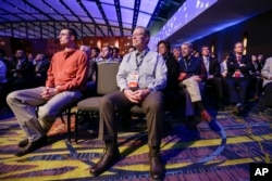 Audience members listen to the Republican presidential primary debate in Des Moines, Iowa, Jan. 28, 2016.