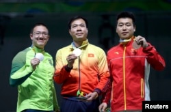 (L-R) Felipe Wu (BRA) of Brazil, Hoang Xuan Vinh (VIE) of Vietnam and Pang Wei (CHN) of China (PRC) pose with their medals.