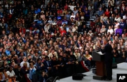 Former President Barack Obama speaks during a rally in Detroit, Oct. 26, 2018. Obama campaigned for Democrats in Michigan and Wisconsin ahead of the midterm elections. In a fiery speech in Milwaukee, he criticized President Donald Trump's tenure in office, assailing him and other Republicans for "making stuff up."