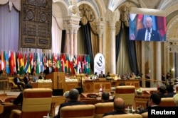 FILE - U.S. President Donald Trump delivers remarks to the Arab Islamic American Summit in Riyadh, Saudi Arabia, May 21, 2017.
