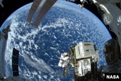 FILE - NASA astronaut Reid Wiseman (pictured here) and European Space Agency astronaut Alexander Gerst completed the first of three spacewalks for the Expedition 41 crew aboard the International Space Station, Oct. 7, 2014. (NASA/ESA/Alexander Gerst)