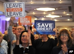 FILE - Supporters during a "Leave Means Leave Rally" are seen at the National Conference Center, Solihull, central England, Sept 30, 2018.