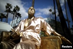 A statue of Harvey Weinstein on a casting couch made by artist Plastic Jesus is seen on Hollywood Boulevard near the Dolby Theatre during preparations for the Oscars in Hollywood, Los Angeles, California, U.S. March 1, 2018.