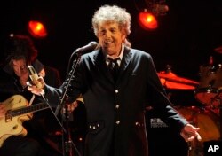 FILE - In this Jan. 12, 2012, file photo, Bob Dylan performs in Los Angeles.