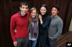 FILE - Alex Honnold, from left, and Sanni McCandless, subjects of the documentary film "Free Solo," pose with co-directors Elizabeth Chai Vasarhelyi and Jimmy Chin at the InterContinental Hotel during the Toronto International Film Festival in Toronto.