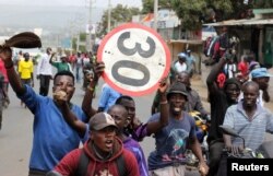 Supporters of Kenyan opposition leader Raila Odinga of the National Super Alliance (NASA) coalition protest against the treason charges on lawyer Miguna Miguna in the streets of Kisumu, Kenya, Feb. 6, 2018.