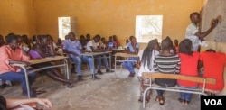 Isidore Tine (right) teaches the English Club of Fandene, Senegal.